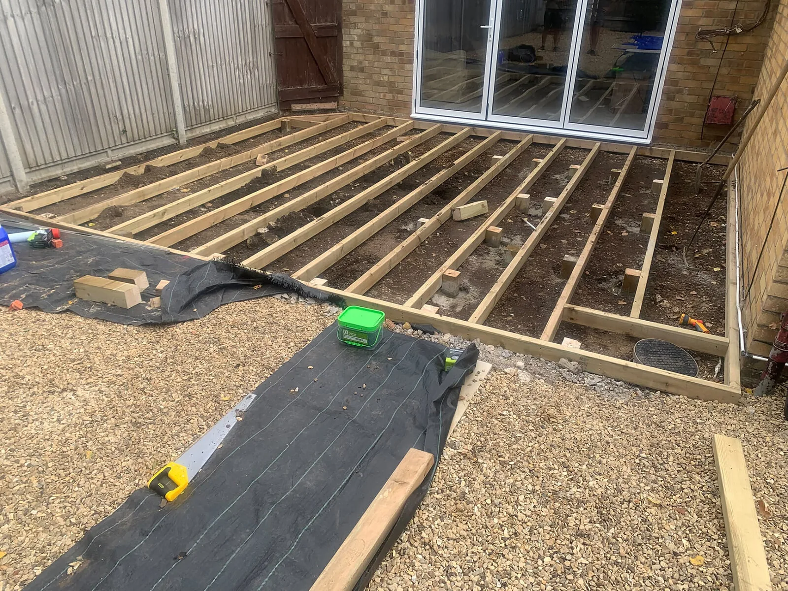 Decking joist frame on weed membrane during construction – Fines Landscaping, West Norfolk