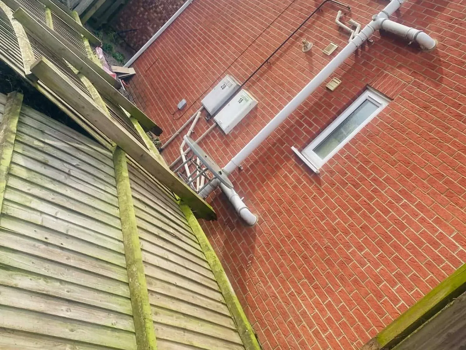 Collapsed old lap fence panels before replacement – Fines Landscaping, West Norfolk