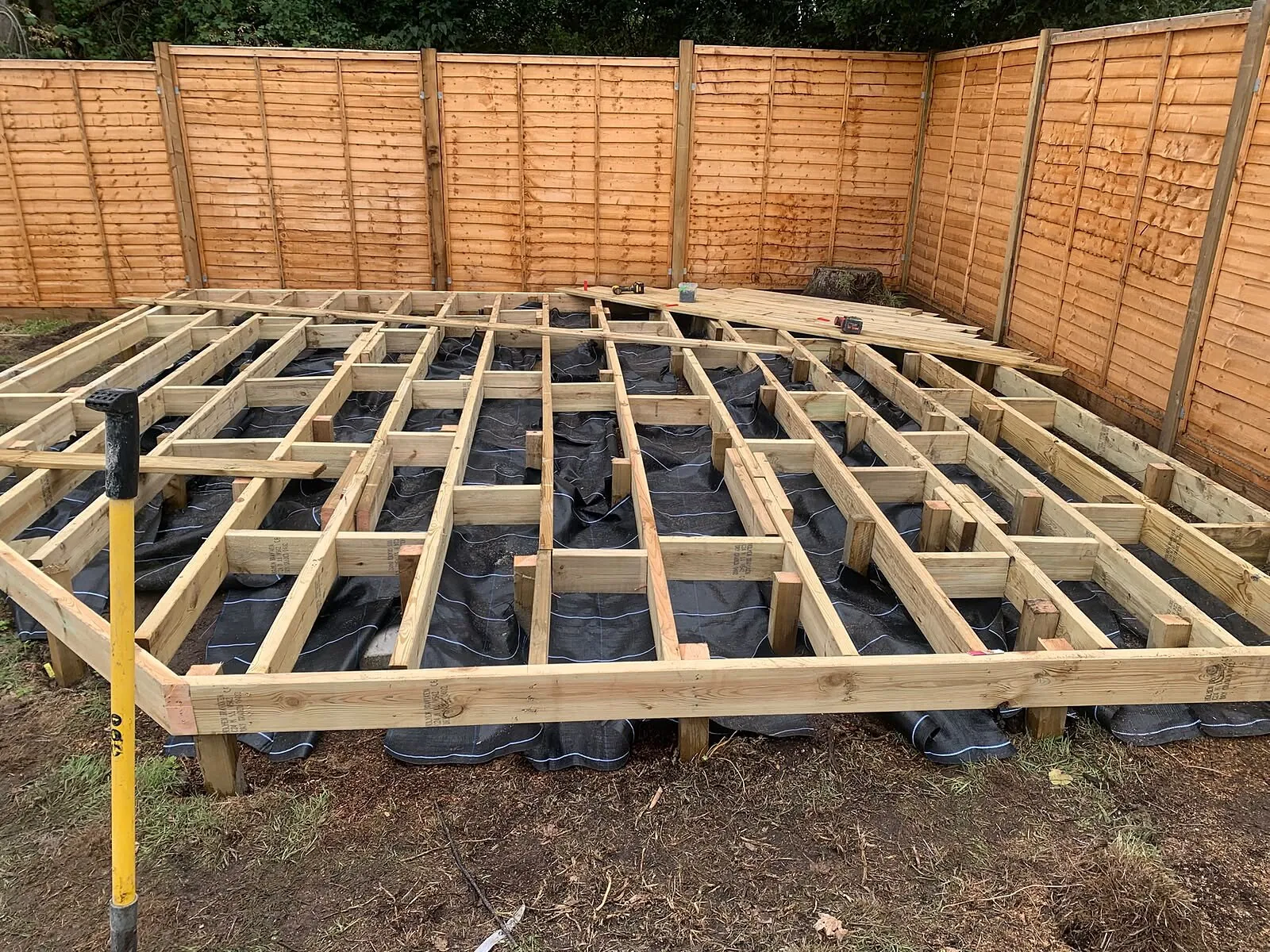Timber decking sub-frame laid out on pads before boarding – Fines Landscaping, West Norfolk